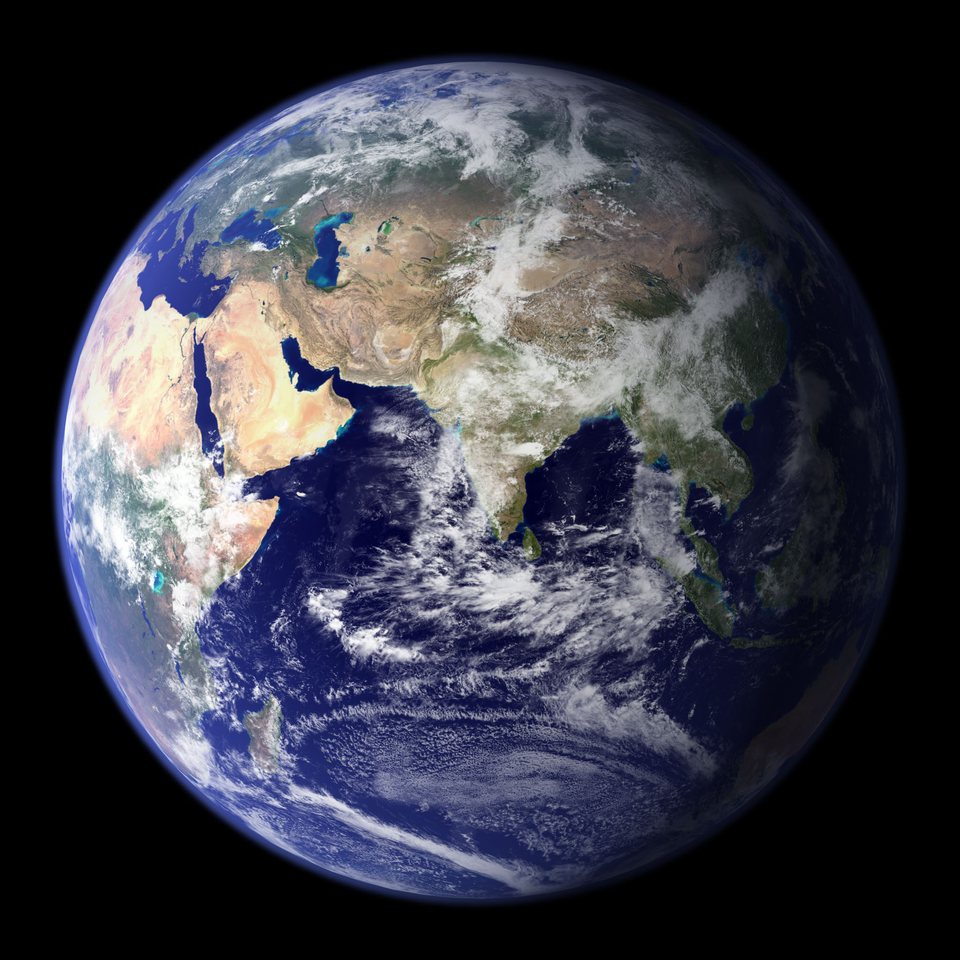 A digitally assembled globe of the Earth centred on the Americas, with clear continents and few clouds